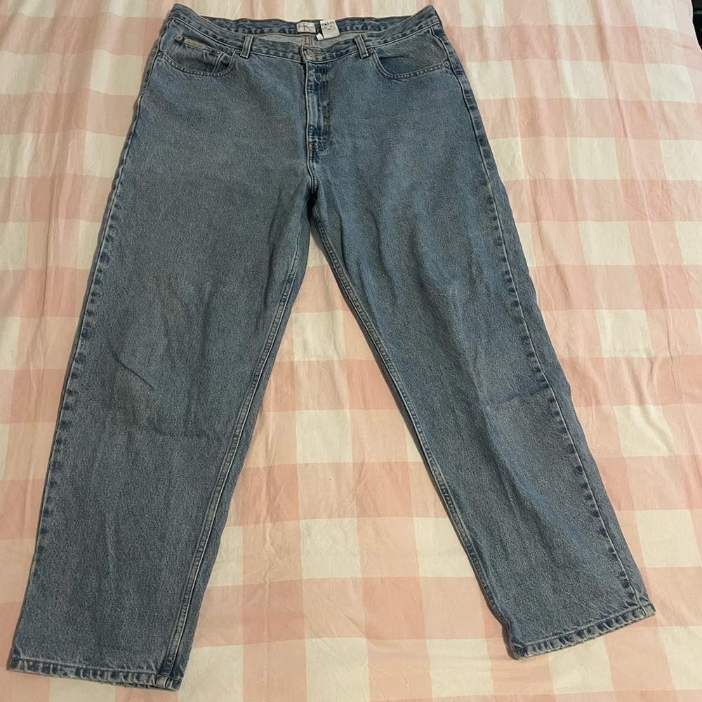 Calvin Klein Jeans. Medium faded blue denim wash. Size 38.
